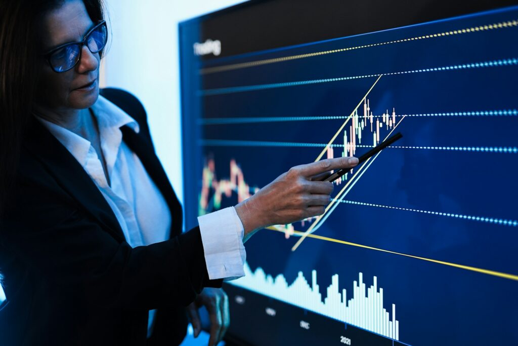 Business woman explaining trading strategies inside bank meeting room